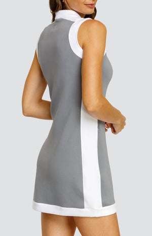 Model wearing a gray sleeveless dress with an open v-neck and chalk inserts on the sides, hem, armholes, shoulder, and collar.