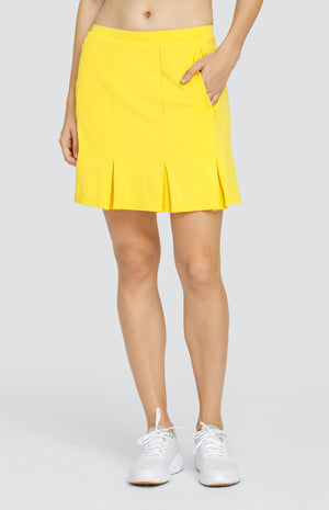 Model is wearing a performance jersey, pull on skort with pleats. Skort has back and side pockets and Dandelion yellow shorties.  