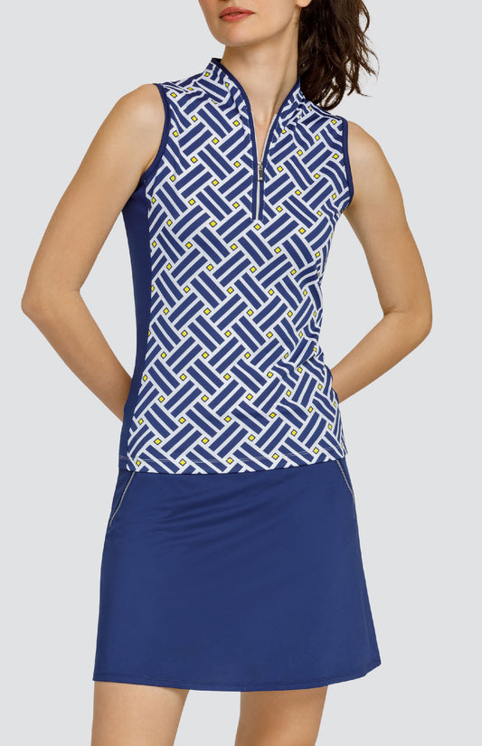 Model is wearing a sleeveless performance jersey top with a Mandarin styled collar. Top is in "Electric Diamond" print, combining Lakestorm blue, Dandelion yellow, and Chalk white. 