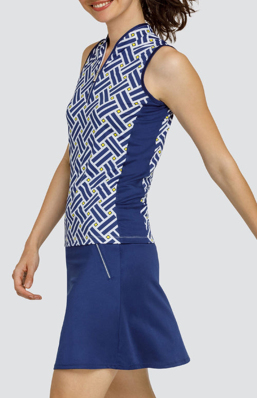 Model is wearing a sleeveless performance jersey top with a Mandarin styled collar. Top is in "Electric Diamond" print, combining Lakestorm blue, Dandelion yellow, and Chalk white. 