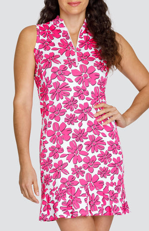 Model is wearing a sleeveless Golf dress with a Pink and Chalk floral print. 